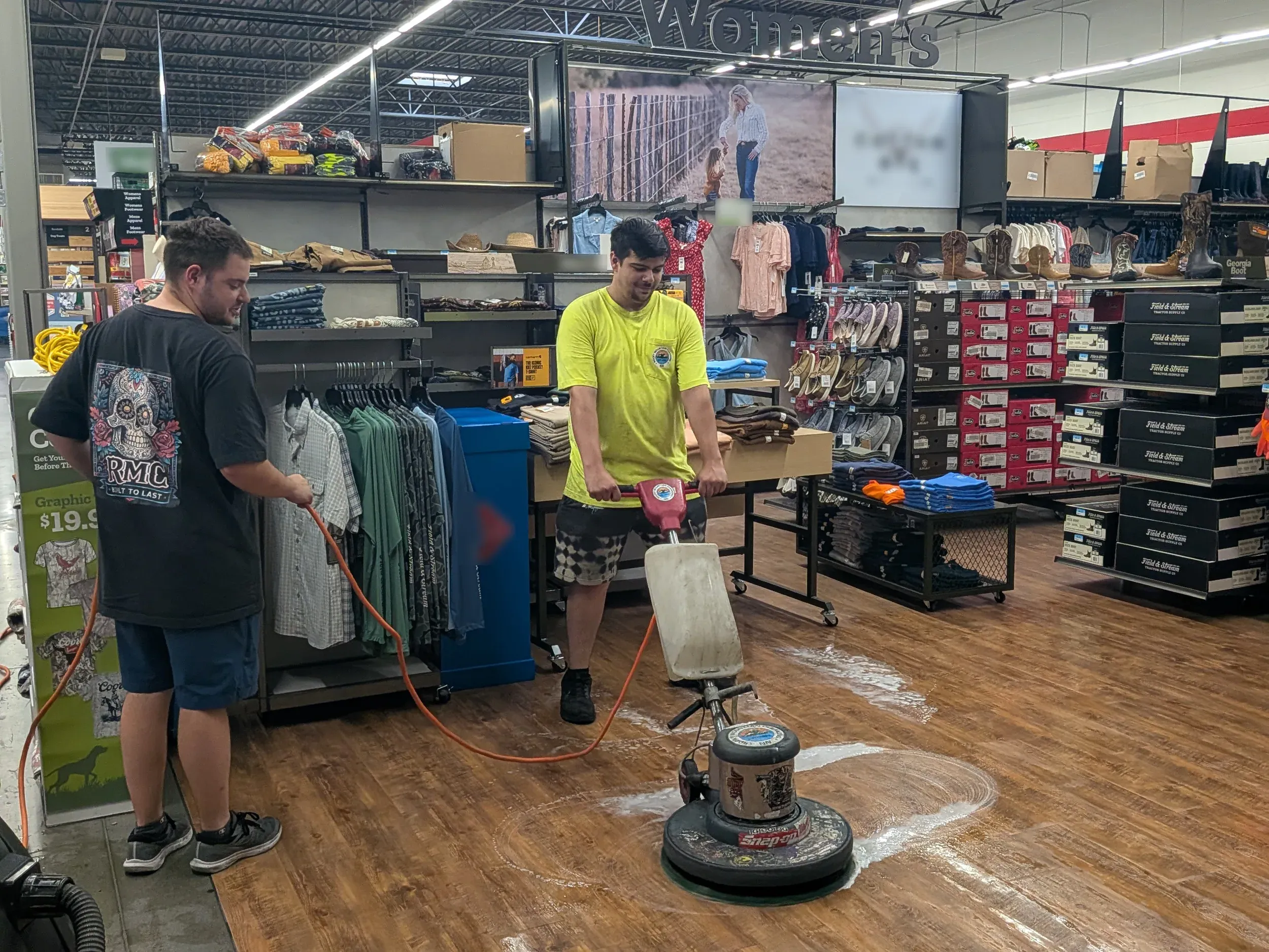 Commercial floor scrubbing: the Rocky Mountain Cleaning crew running an auto scrubber down a retail store aisle.